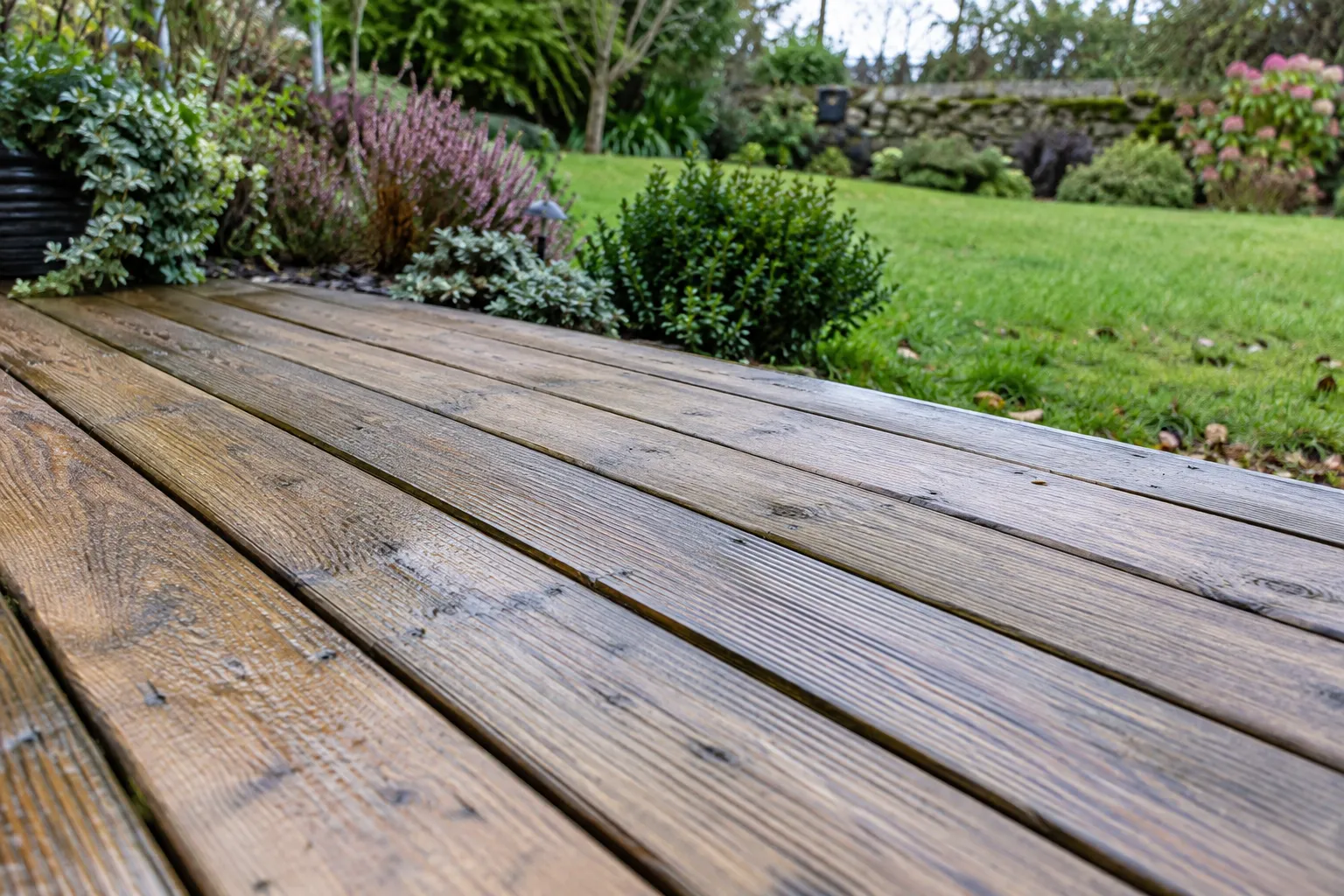 Illustrative timber decking showing the natural grain and board joints